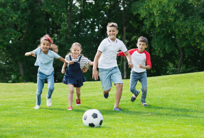 kids kicking soccer ball